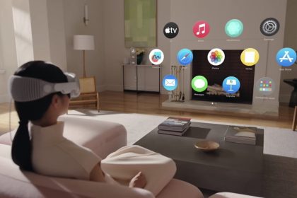 A person using Apple Vision Pro in a living room, interacting with floating app icons projected in the air.