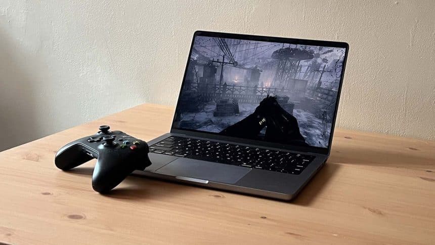 Gaming on a MacBook with a connected controller.