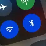 Close-up of a phone screen showing the Bluetooth icon.