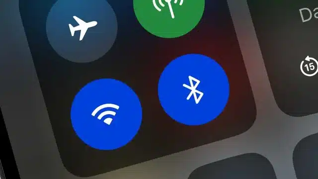 Close-up of a phone screen showing the Bluetooth icon.