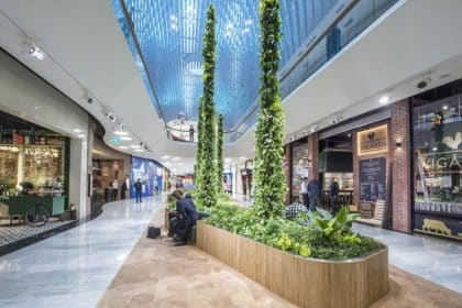 A modern shopping area with greenery at the Mall of Scandinavia.