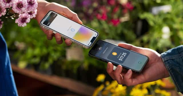 Two smartphones exchanging payments via NFC technology.