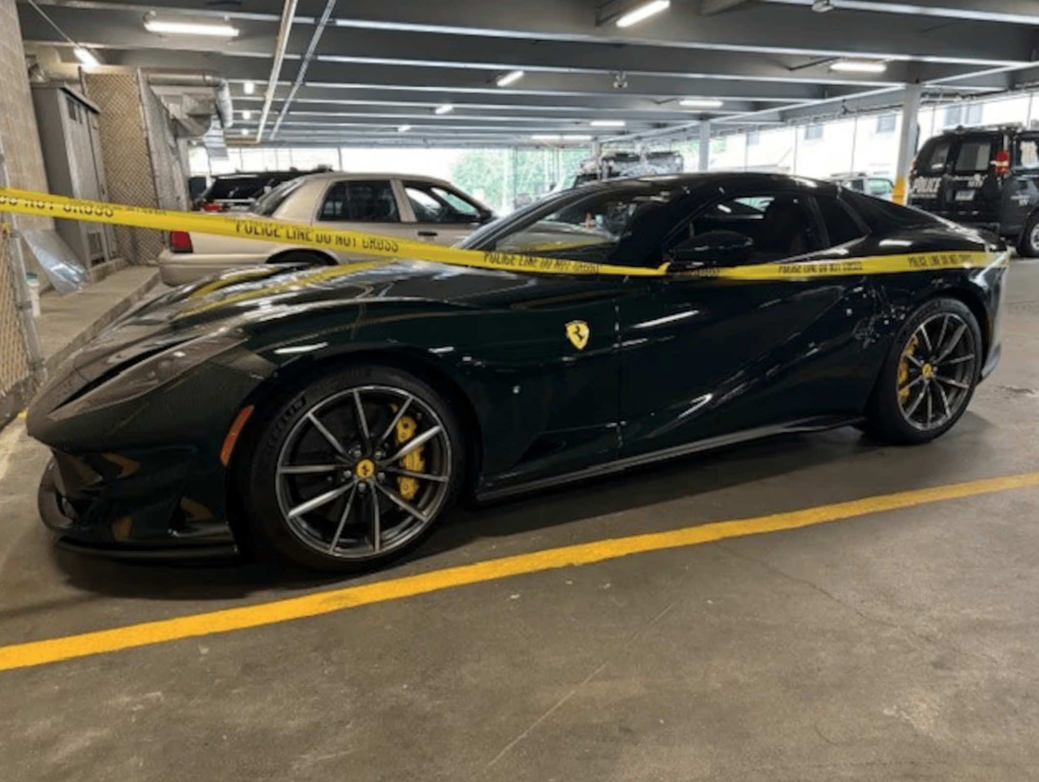 Recovered stolen Ferrari 812 GTS wrapped in police tape.