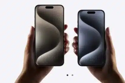 Hands holding iPhone 16 models.