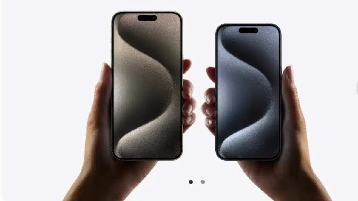 Hands holding iPhone 16 models.