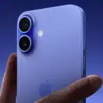 Close-up of a person holding an iPhone 16 in blue.