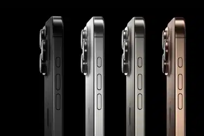 Side view of four iPhone 16 Pro models in different colors.