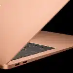 Side view of a MacBook Air in gold color.