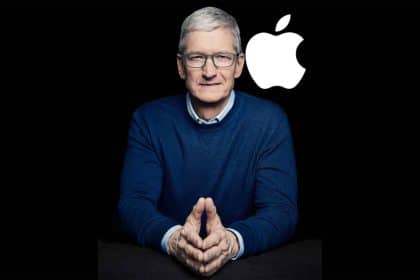 Apple CEO Tim Cook with the Apple logo in the background.