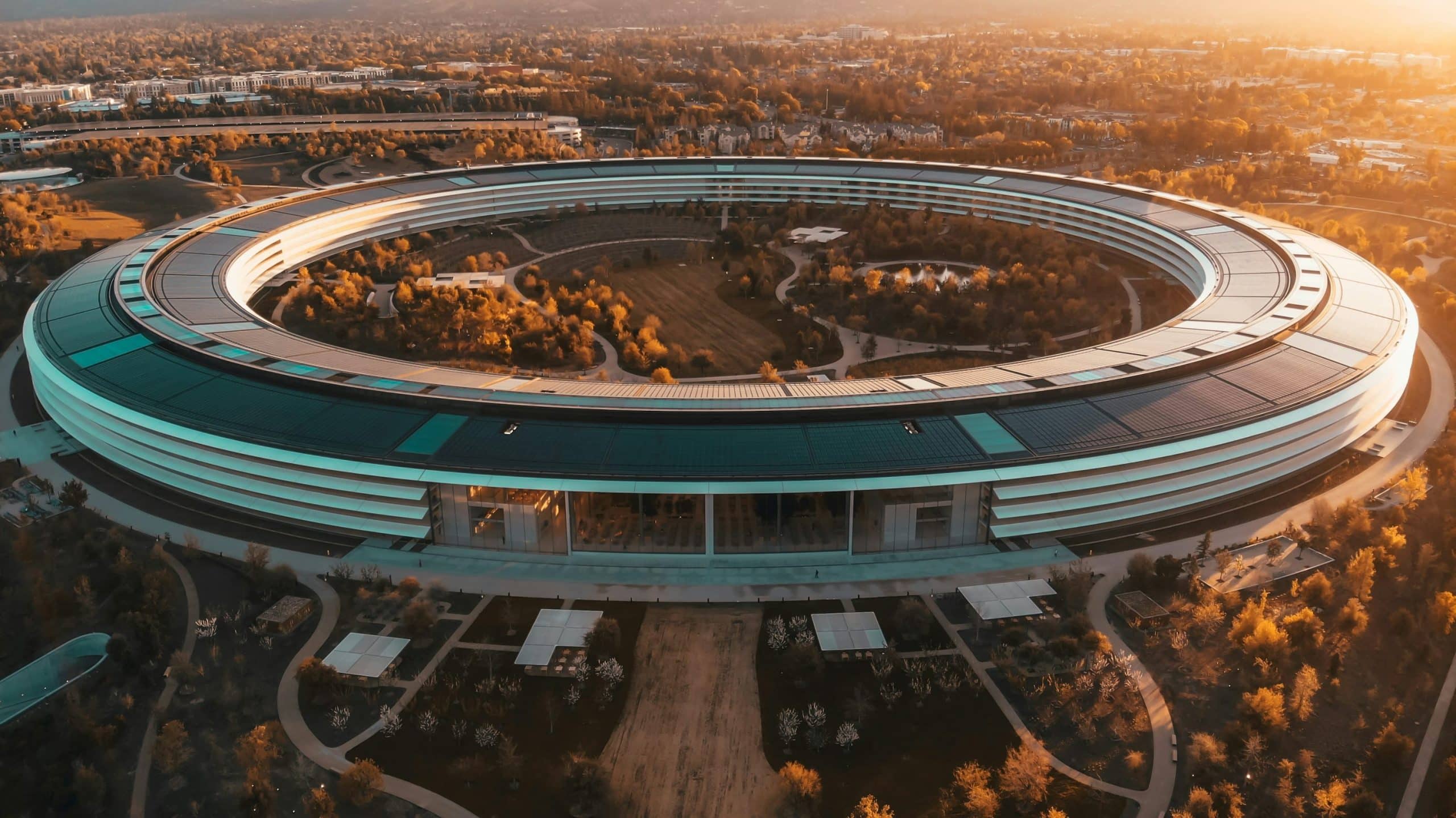 Apple Park headquarters aerial view at sunset.