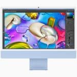 iMac displaying colourful graphics on the screen.