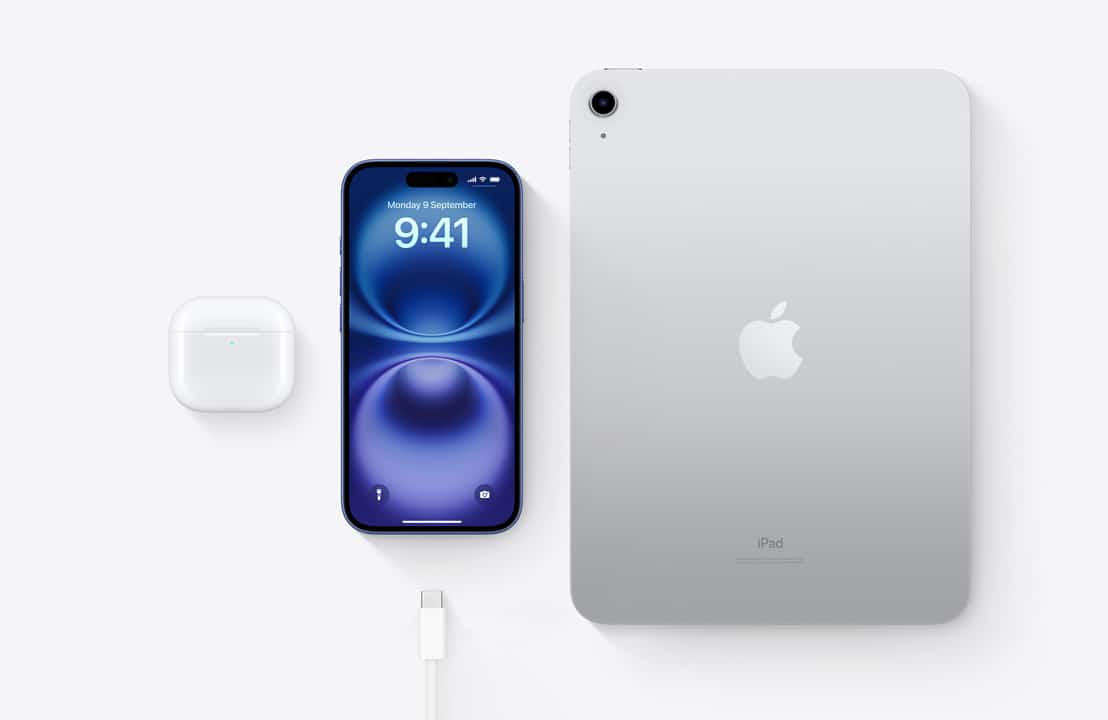 iPhone, iPad, AirPods, and charging cable on a white background.