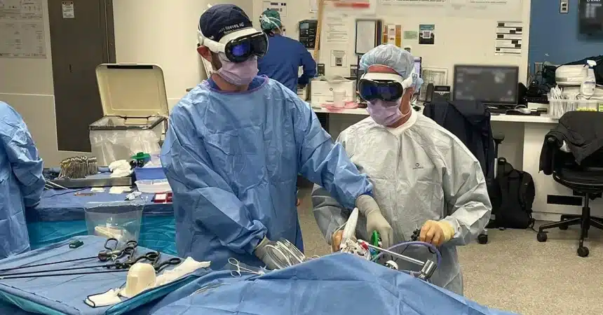 Surgeons wearing Apple Vision Pro headsets during a procedure.