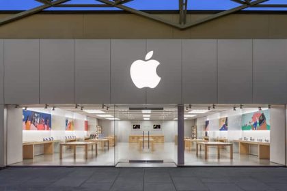 Front view of an Apple Store with a large Apple logo.