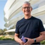 Tim Cook holding an iPhone.