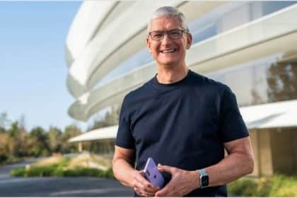 Tim Cook holding an iPhone.