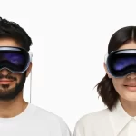 Two people wearing Apple Vision Pro headsets.