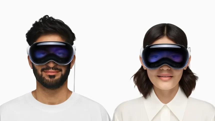 Two people wearing Apple Vision Pro headsets.