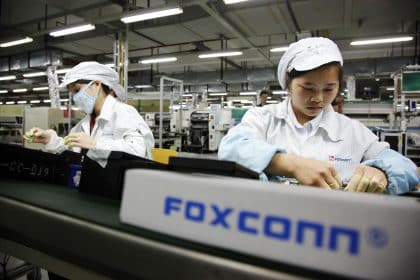 Workers assembling products at a Foxconn factory.