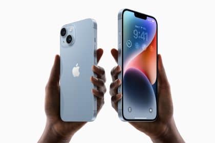 Hands holding an iPhone with front and back view.