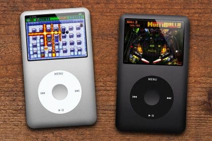 Two iPods with click-wheels displaying classic games on their screens.