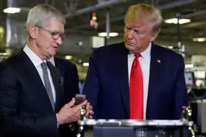 Tim Cook and Donald Trump at a factory.