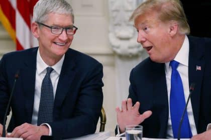 Tim Cook and Donald Trump sharing a conversation.