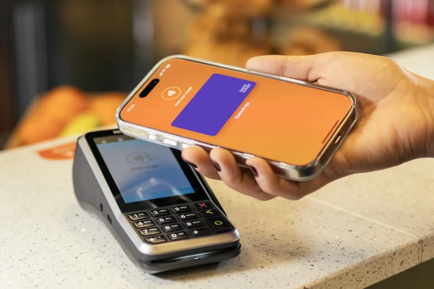 Using an iPhone for contactless payment at a terminal.