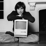 Steve Jobs with the original Macintosh computer.