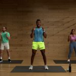 Group workout session led by an Apple Fitness+ trainer.