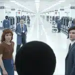 Severance TV show scene with main characters in a bright office hallway.