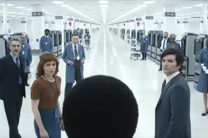 Severance TV show scene with main characters in a bright office hallway.