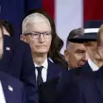 Tim Cook attending a formal event with Donald Trump and others.