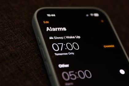 iPhone alarm screen showing set wake-up times.