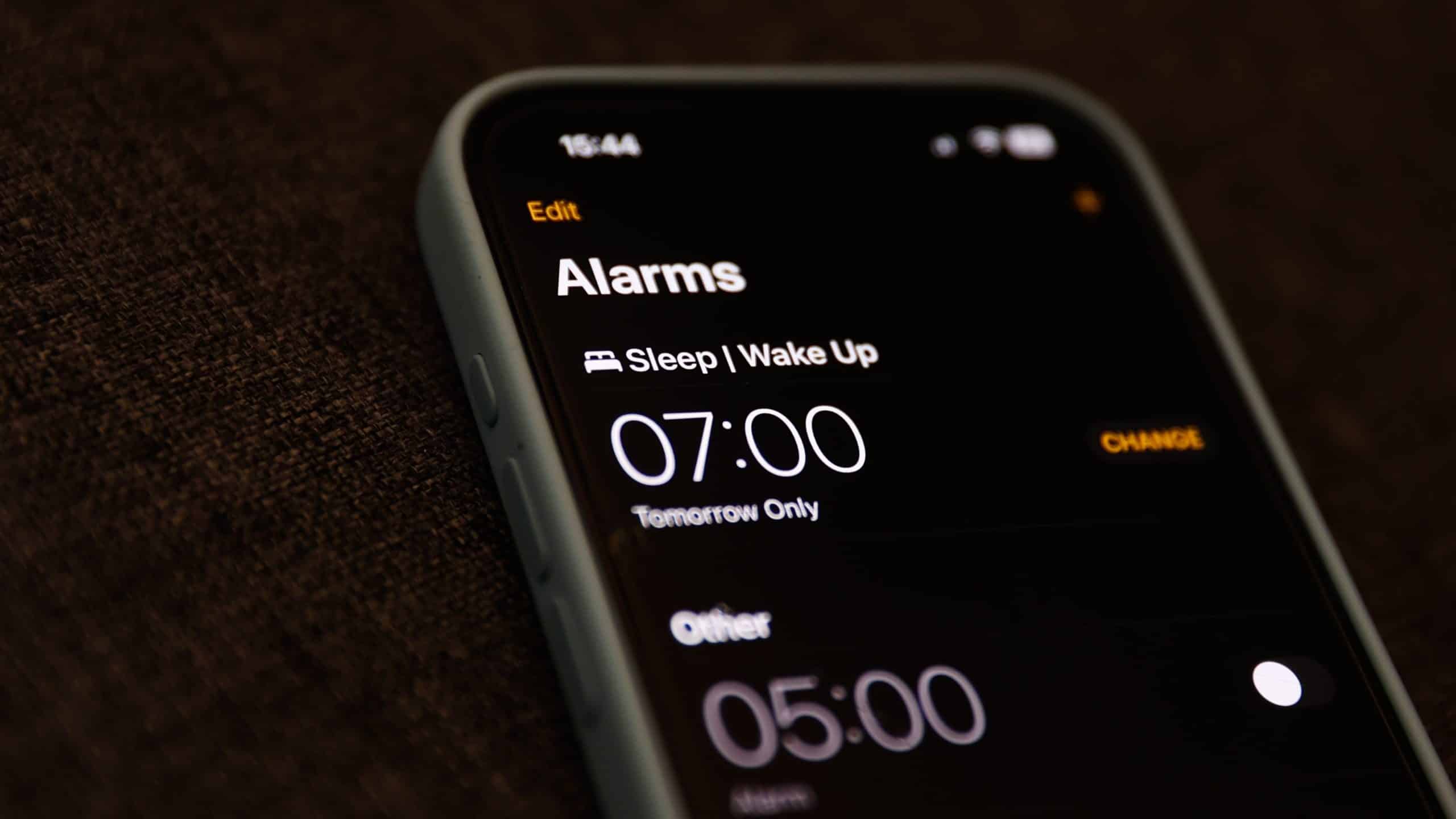 iPhone alarm screen showing set wake-up times.