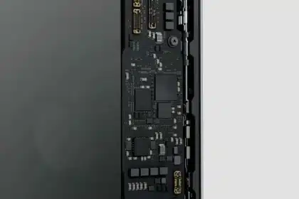 A close-up view of an iPhone's internal circuit board, showing the next-gen C2 modem and electronic components.