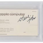 Steve Jobs-signed Apple business card in a protective case.