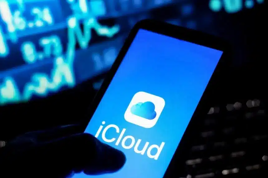 A smartphone displaying the iCloud logo on its screen.