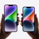 Two hands holding iPhone models with vibrant displays against a white background.