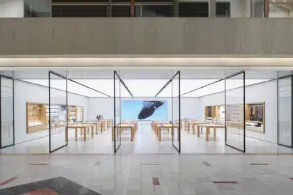 Apple Store inside Northbrook Court mall with glass walls and wooden tables.