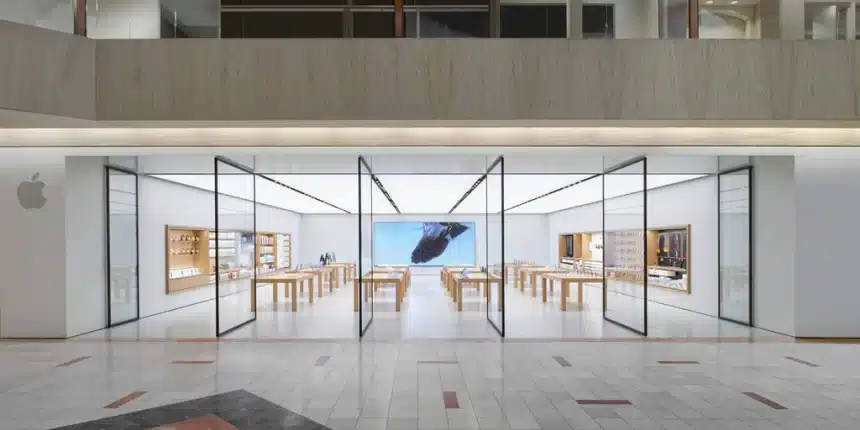 Apple Store inside Northbrook Court mall with glass walls and wooden tables.