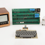 Apple-1 computer with original keyboard, monitor, power supply, and circuit board.