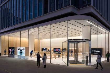 Apple Store in Hongdae, South Korea, with a modern glass facade and interior displays.