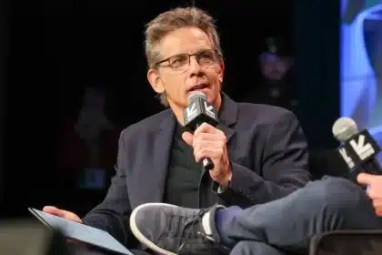 Ben Stiller speaking at SXSW, holding a microphone during a panel discussion.