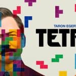 Movie poster for Tetris featuring Taron Egerton with colourful Tetris blocks overlaying his face.