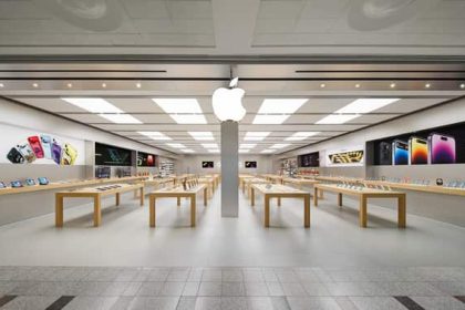 Apple Store in the UK displaying iPhones and other Apple products.