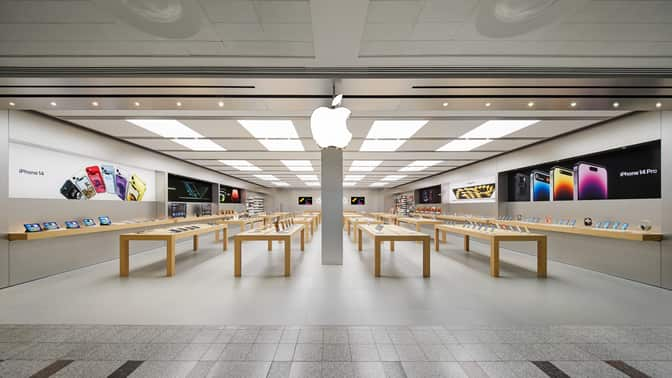 Apple Store in the UK displaying iPhones and other Apple products.